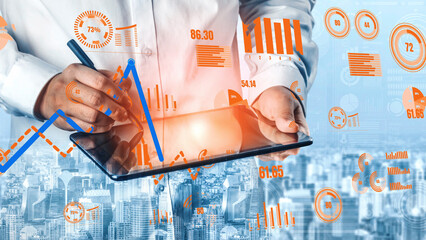 A business professional uses a tablet to analyze financial data and trends, set against a vibrant city skyline, representing modern analytics and corporate insights. Xenic