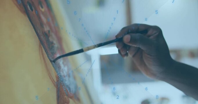 Painter's hand reaching brush dipping into paint applying strokes as numeric overlay enhancing art