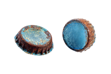 two rusty metal caps sitting next to each other