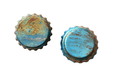 two blue bottle caps with rust on them