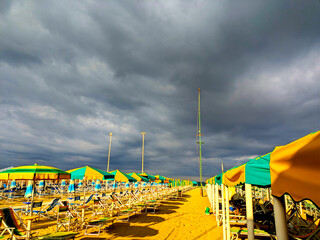 Colorful Umbrellas Under a Dramatic Stormy Sky