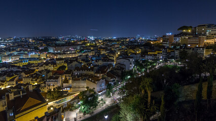 Lisbon aerial view of city centre with illuminated building at night timelapse, Portugal