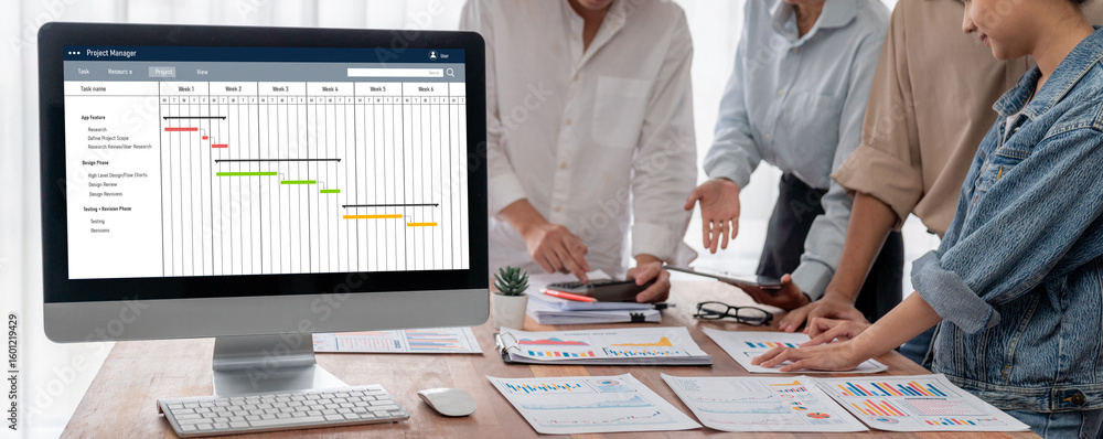 Poster project planning software for brisk business project management on the computer screen showing timel
