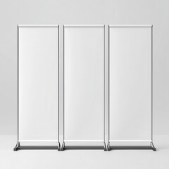 Three blank white roll up banner stands arranged side by side isolated on white background