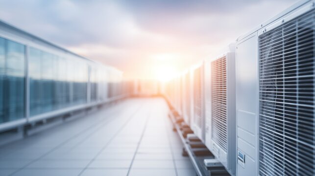 A close-up aerial view of a high-tech data center, showing the rooftop cooling systems, - Powered by Adobe