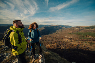 Hikers enjoying scenic mountain view during trekking adventure