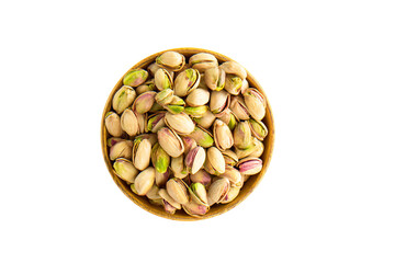 a bowl of pistachios on a white surface