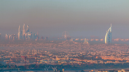 Dubai Marina and Jumeirah beach during sunrise with early morning fog timelapse in Dubai, United Arab Emirates