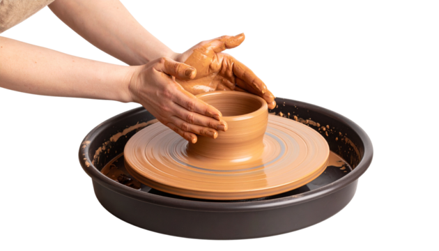 Close-up of hands shaping clay on a pottery wheel isolated on white background.