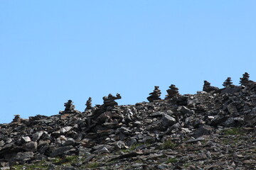 figurines laid out of stones in the mountains of Dombai