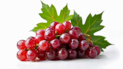 Fototapeta premium A cluster of juicy red grapes with green leaves is isolated on a white background. Suitable for food, nutrition, healthy eating, and product packaging concepts.
