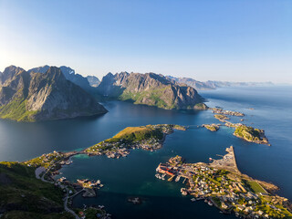 Panoramic aerial view of Reine village in the Lofoten Islands, Norway, surrounded by fjords,...