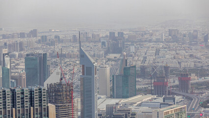 Downtown of Dubai in the morning timelapse after sunrise. Aerial view with towers and skyscrapers
