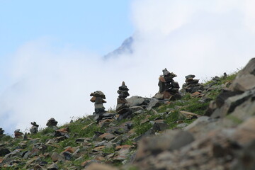 figurines laid out of stones in the mountains of Dombai