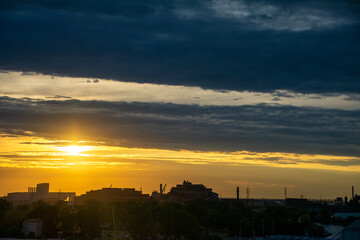 Fototapeta premium Sunset silhouettes at oil refinery Detroit Michigan 