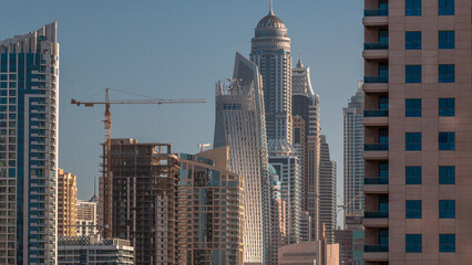 Modern skyscrapers in Dubai Marina early morning during sunrise, close up, in Dubai, UAE