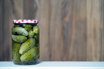 pickled cucumbers in glass jar