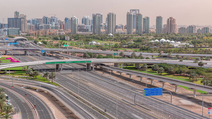 Dubai Golf Course with a cityscape of Greens and tecom districts at the background aerial timelapse