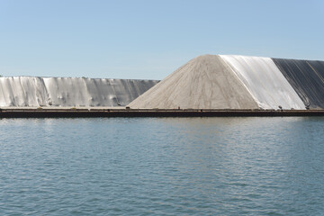 pile of aggregate material and ship channel