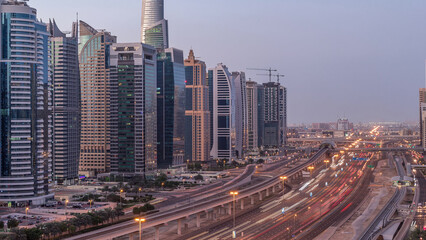 Aerial top view to Sheikh Zayed road near Dubai Marina and JLT night to day timelapse, Dubai.