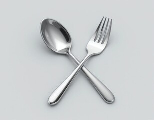 Silver spoon and fork crossed on a light gray background