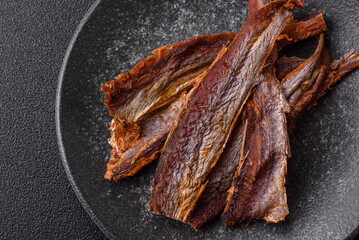 Dried salted fish as snacks or jerky, seafood as slices. Dried seafood snacks