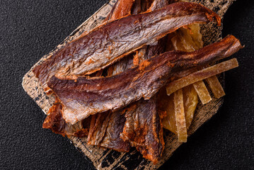 Dried salted fish as snacks or jerky, seafood as slices. Dried seafood snacks
