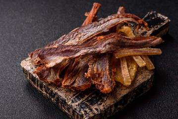Dried salted fish as snacks or jerky, seafood as slices. Dried seafood snacks