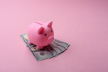 House, buying or selling real estate, concept background with money and piggy bank. Real estate