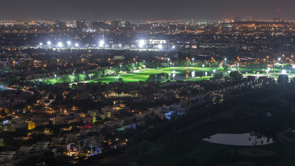 Aerial view to villas and houses with Golf course night timelapse