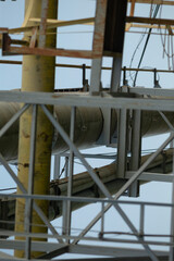 A sizable and robust metal structure featuring numerous pipes intricately weaving through and around it, often utilized in construction projects