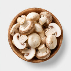 A wooden bowl filled with fresh white and brown mushrooms on a white background overhead view close up