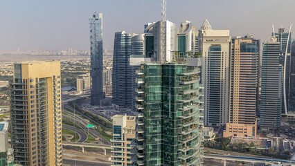 Obraz premium Aerial top view of Dubai Marina morning timelapse. Modern towers and traffic on the road