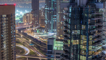 Obraz premium Aerial view of a road intersection in a big city night timelapse.