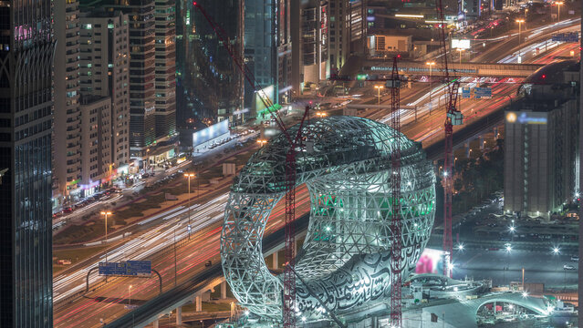 Construction site of the Museum of the Future aerial night timelapse, next iconic building of Dubai.