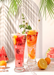 Refreshing summer homemade cocktail, sangria, lemonade with watermelon, apricot, currant, mint and...