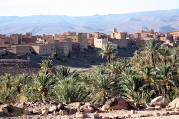 Aït Benhaddou, a traditional desert village in Morocco, featuring earthen clay houses and palm...