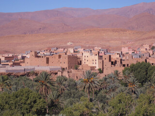 Aït Benhaddou, a traditional desert village in Morocco, featuring earthen clay houses and palm...