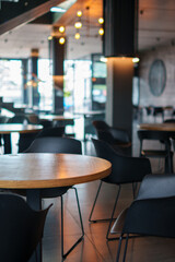 Modern cafe interior with wooden tables
