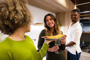 Friends enjoying pizza and wine at a cozy gathering