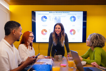 Diverse team engaged in a technology presentation meeting