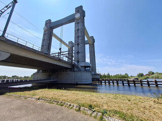 Vertical lift bridse Hoge Gouwespoorbrug over the Gouwe Canal in Gouda city
