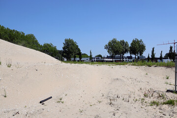 Piles of sand waiting for building Qbuzz garage