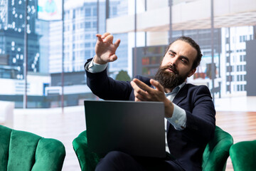General director uses an AR hologram for analysis in his luxurious office, studying financial...