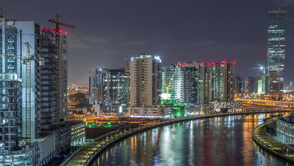 Fototapeta premium The rhythm of the city of Dubai near canal aerial timelapse