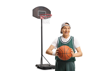 Senior man in a sports jersey holding a basketball and smiling