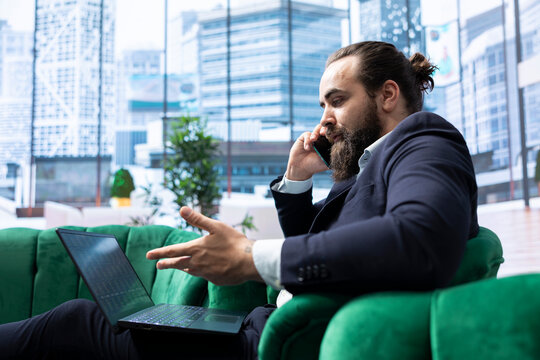 General director finalizing an agreement with investors group over phone call, balancing corporate responsibilities and strategic planning. Ensuring sustainable growth and business success.