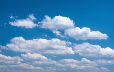 Fototapeta premium A blue sky with fluffy white clouds