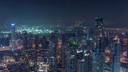 Fototapeta premium Amazing aerial view of Dubai downtown skyscrapers night timelapse, Dubai, United Arab Emirates