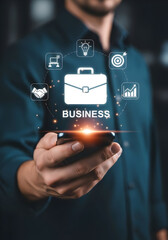 Modern businessman using smartphone with business icons, success and innovation concept
